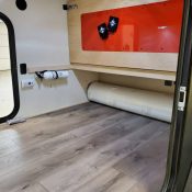 Interior view through open door of an Adventure camping trailer at Earthship Overland at their showroom in Englewood, CO